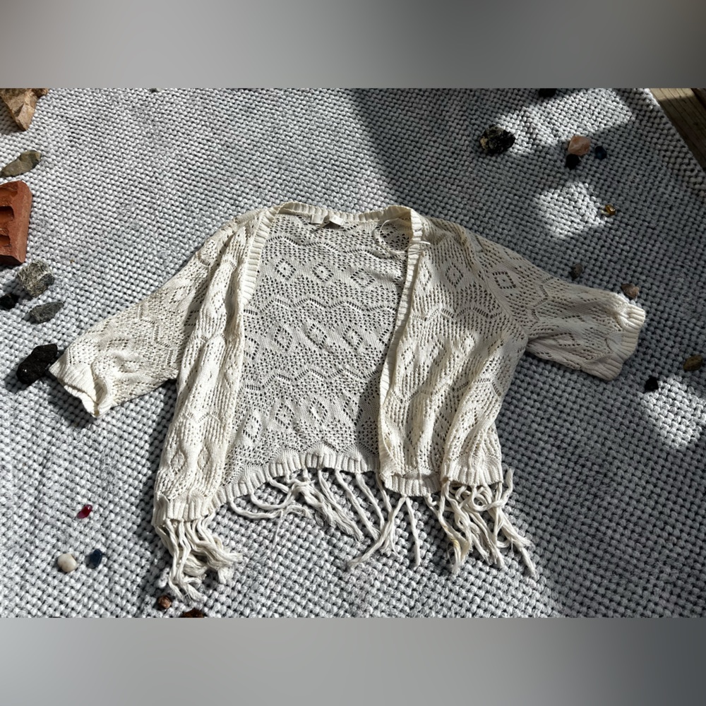 White knitted cardigan with fringe